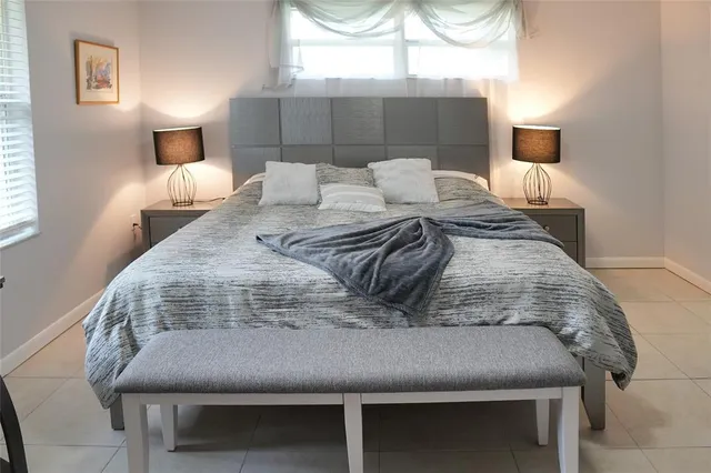 a white toilet sitting next to a shower