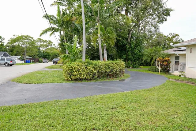 a living room with furniture and chandelier