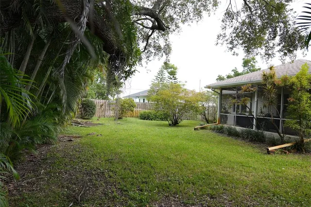 a living room with furniture kitchen and a table