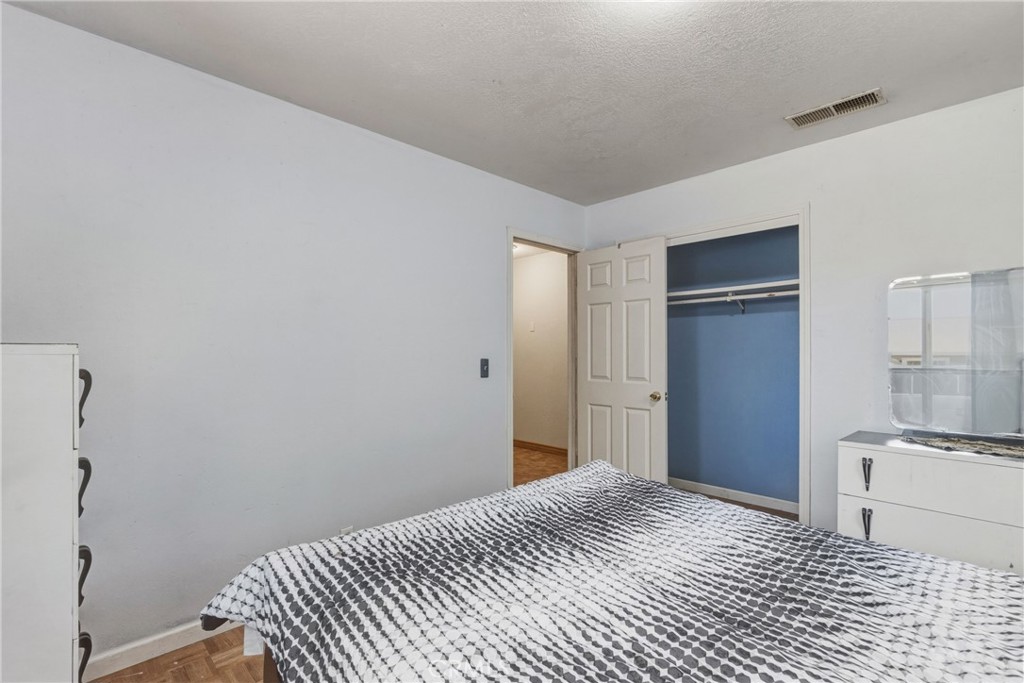 6812 Helton Street Winton, CA 95388 - Photo 12 of 24 a bedroom with a bed and cabinets