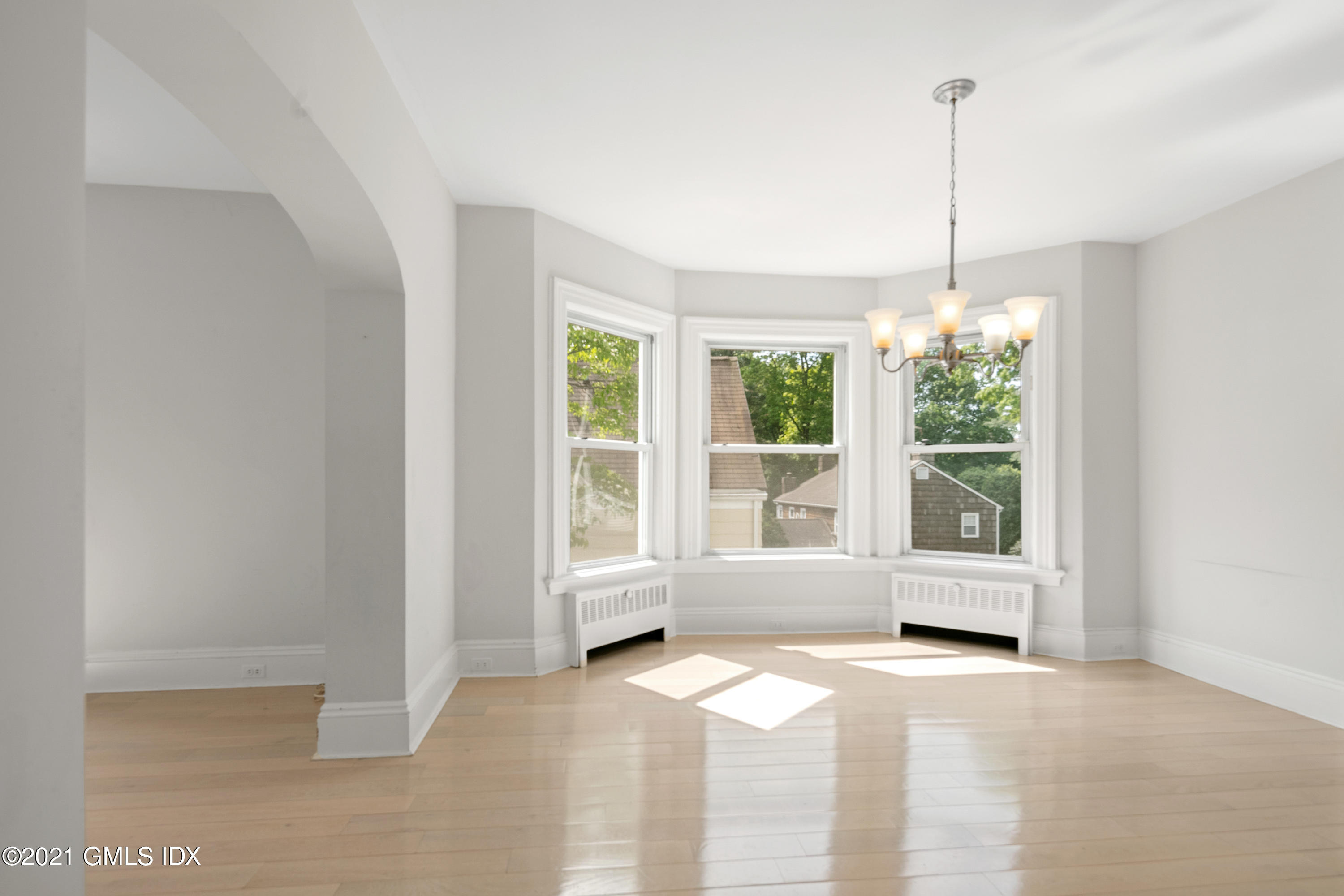 14 Byram Shore Road, Unit 1 Greenwich, CT 06830 - Photo 5 of 30 a view of an empty room with windows and outdoor view