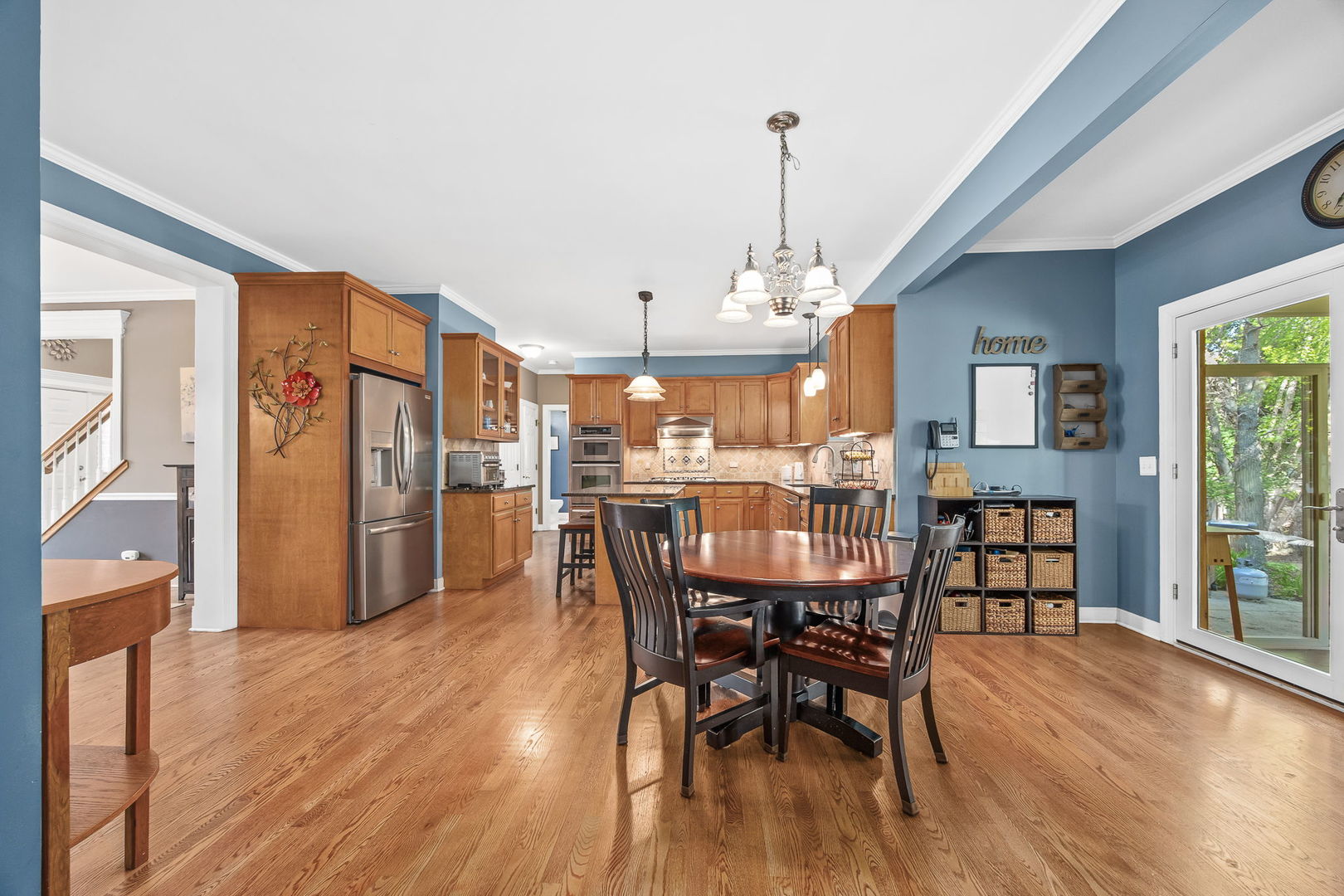 2816 Cordgrass Road Naperville, IL 60564 - Photo 4 of 49 a dining room with furniture and wooden floor