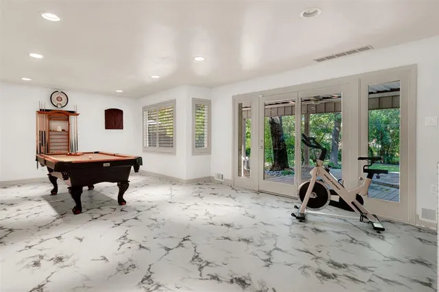 a view of a livingroom with workspace and a window
