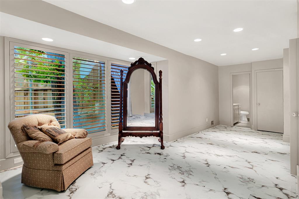 13311 Purple Sage Road Dallas, TX 75240 - Photo 15 of 31 a living room with furniture and a large window