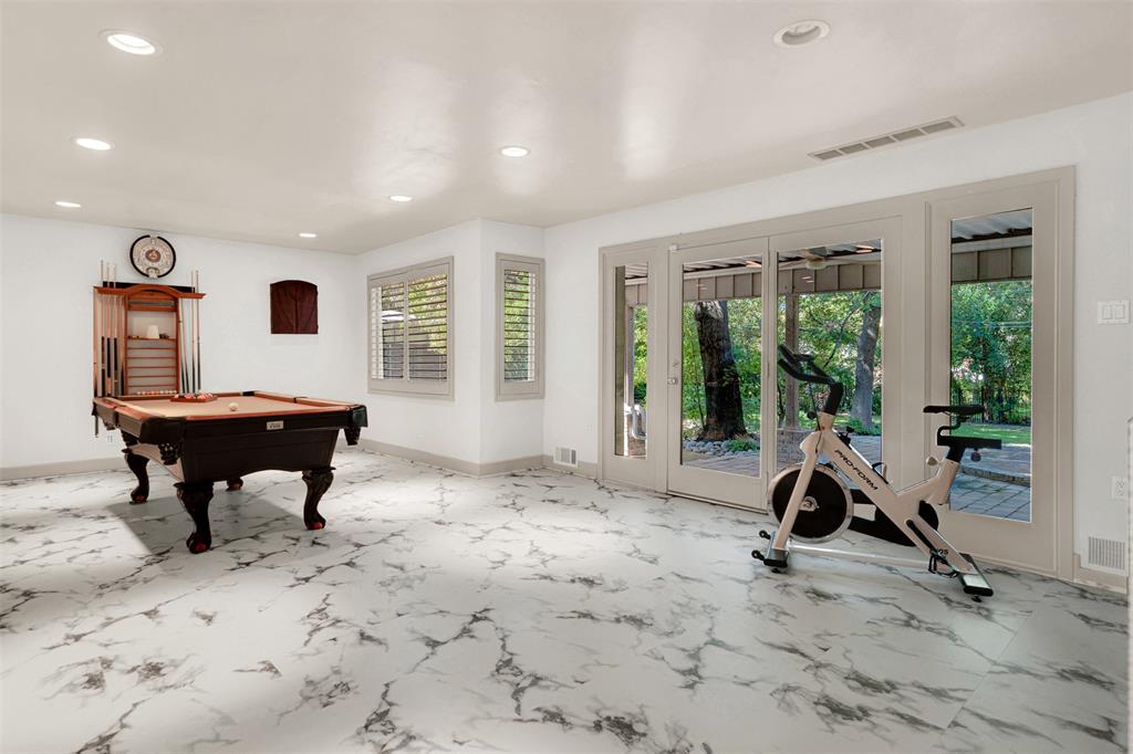 13311 Purple Sage Road Dallas, TX 75240 - Photo 15 of 26 a view of a livingroom with workspace and a window