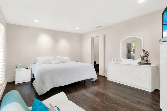 a room with a bed and a mirror