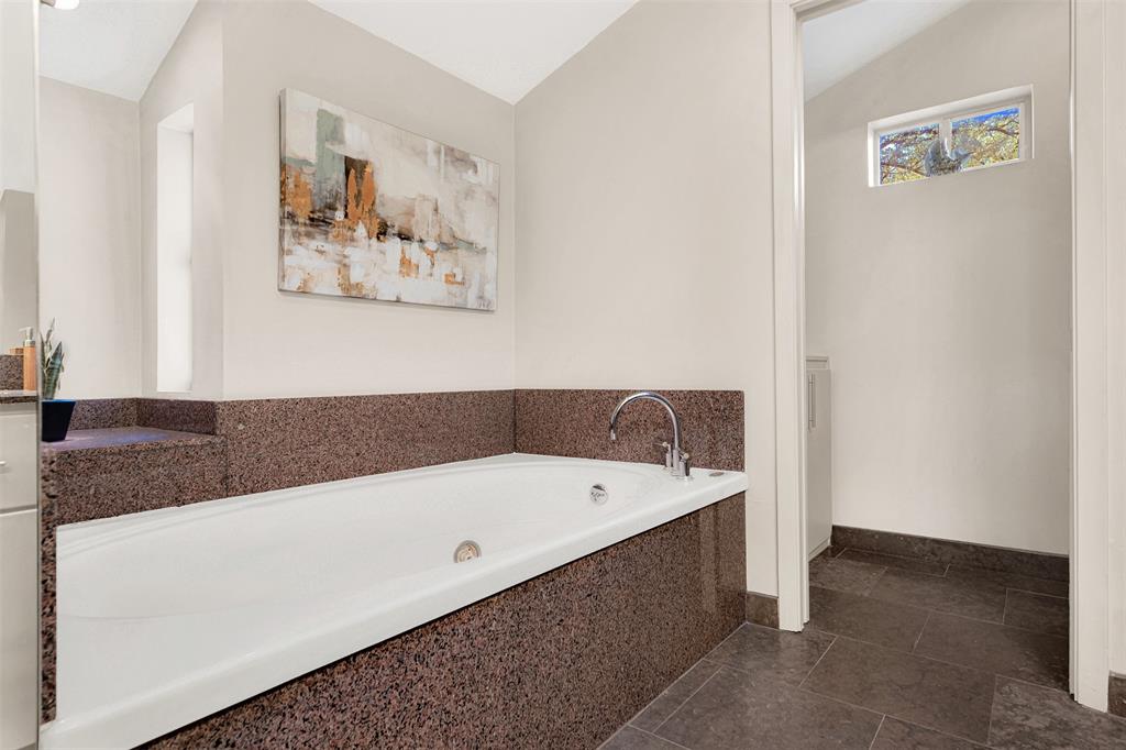 13311 Purple Sage Road Dallas, TX 75240 - Photo 21 of 31 a bathroom with a tub a sink and a shower