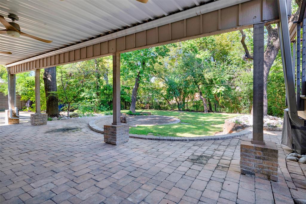 13311 Purple Sage Road Dallas, TX 75240 - Photo 22 of 26 a view of a porch with furniture and garden