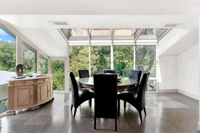 a view of a dining room with furniture window and outside view