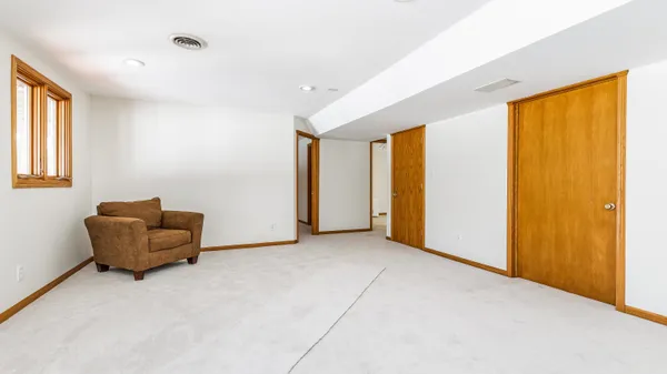 a view of balcony with wooden floor and fence