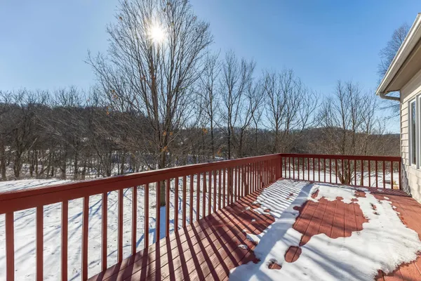 a view of a backyard with wooden fence