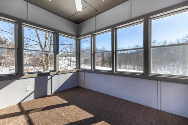 a view of an empty room and window