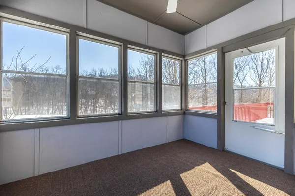 a view of an entryway with wooden floor and stairs