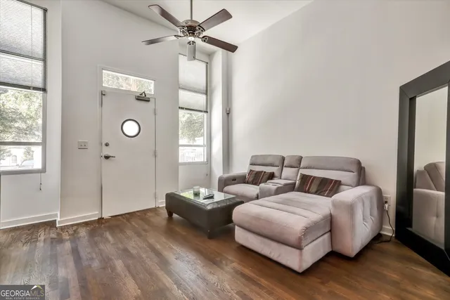 a living room with couches and a window