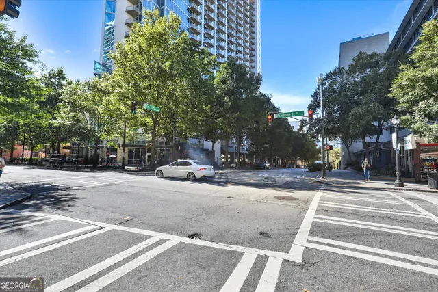 a view of street with with large trees