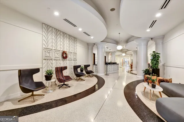 a living room with fireplace furniture and a wooden floor