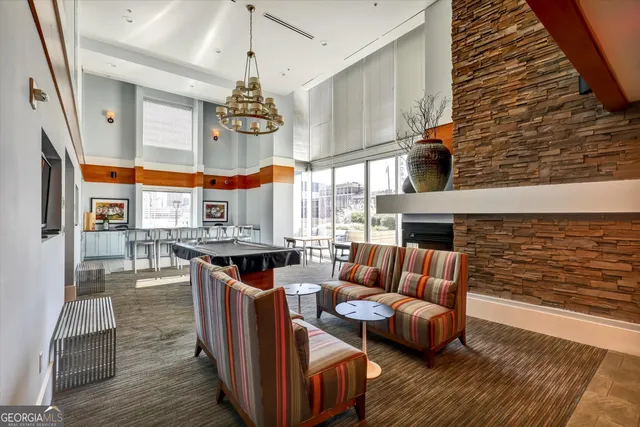 a outdoor living space with furniture and a flat screen tv