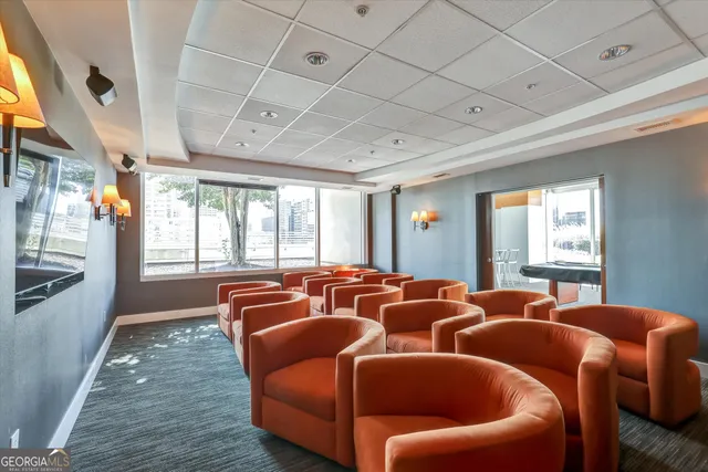 a dining table with chairs and window