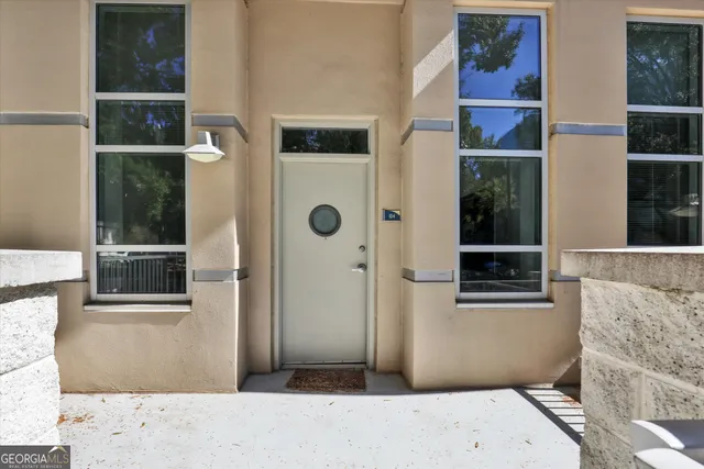 a view of a door and a window