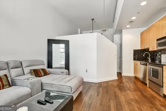 a bedroom with a bed and a couch