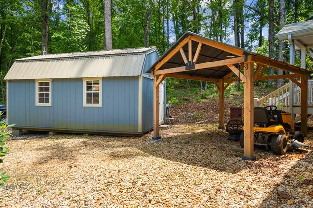 a backyard of a house with table and chairs