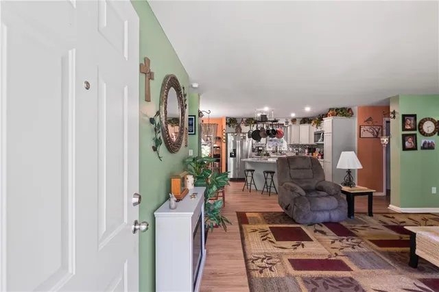 a living room with lots of furniture and a rug