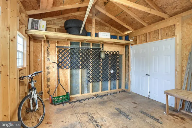a view of a room with wooden walls and stairs