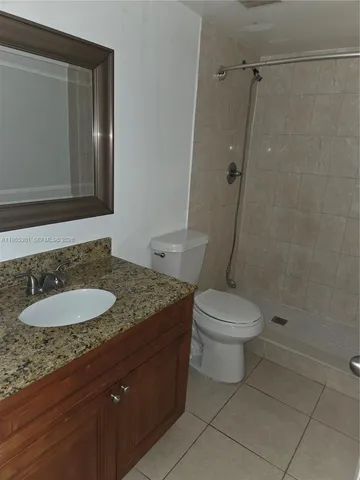 a bathroom with a shower and a toilet