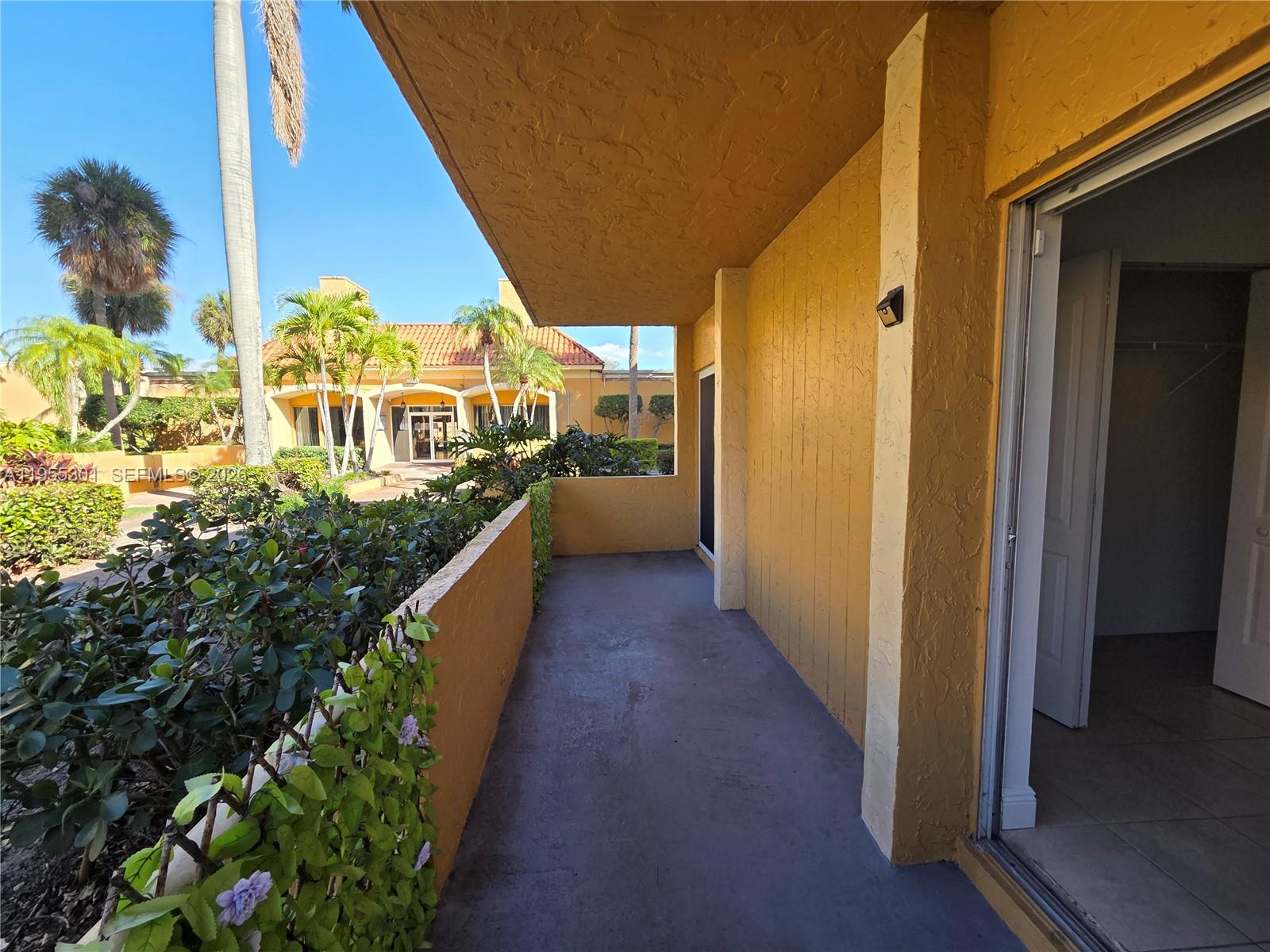 17901 Northwest 68th Avenue, Unit T106 Hialeah, FL 33015 - Photo 19 of 31 a view of a balcony