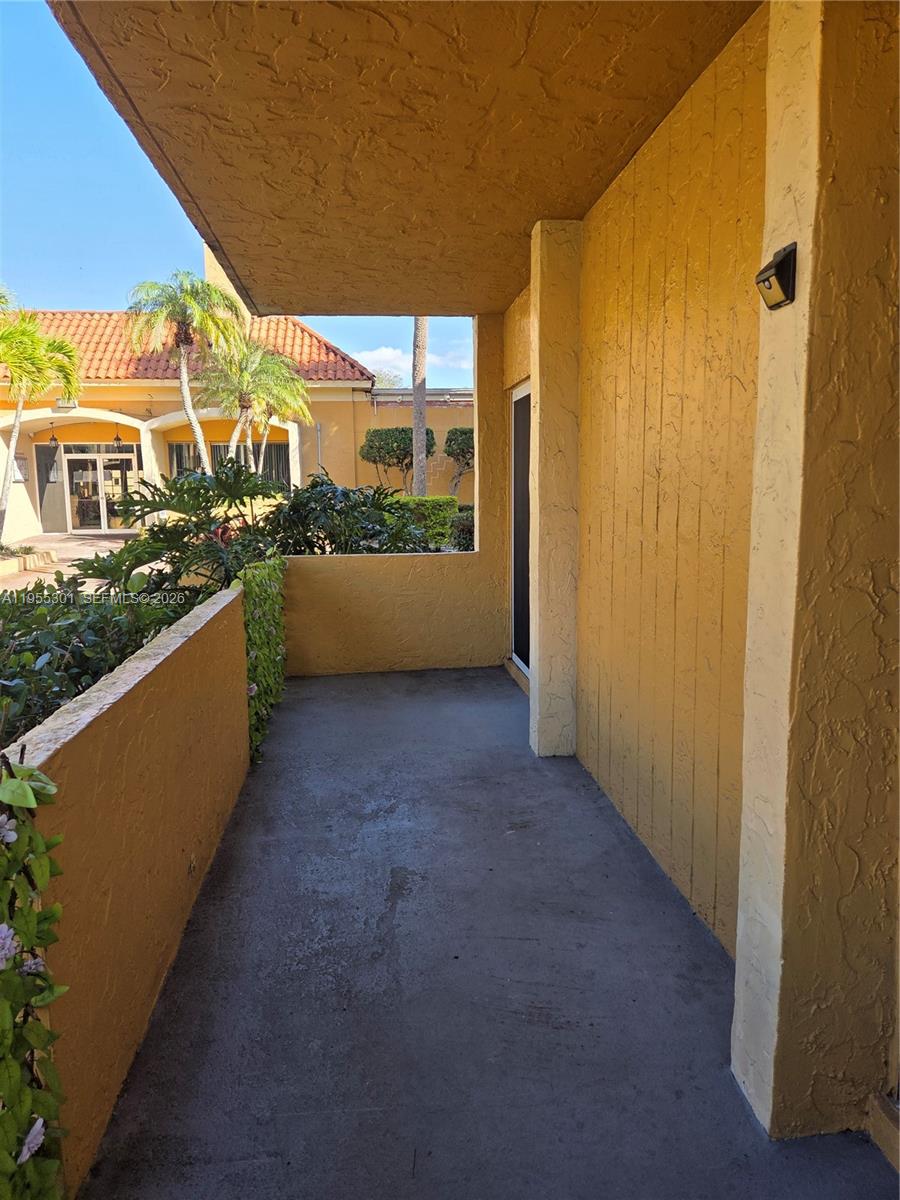 17901 Northwest 68th Avenue, Unit T106 Hialeah, FL 33015 - Photo 22 of 31 a view of balcony with furniture