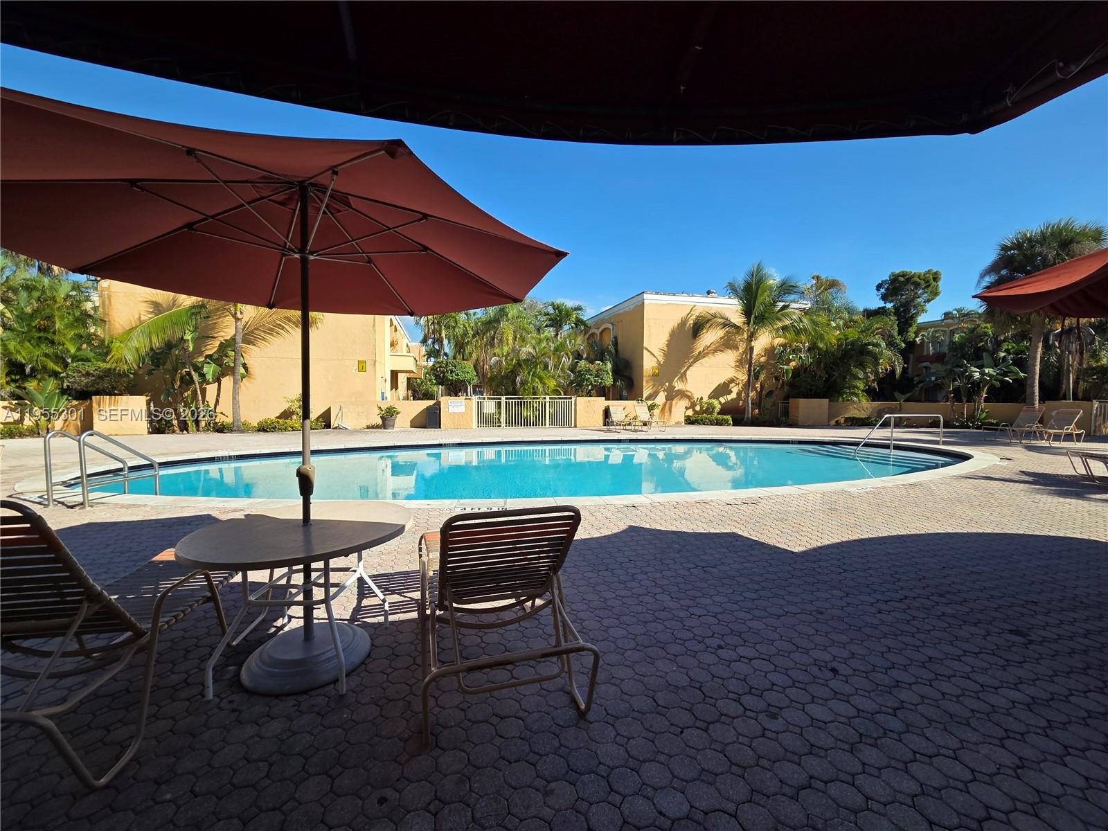 17901 Northwest 68th Avenue, Unit T106 Hialeah, FL 33015 - Photo 24 of 31 a view of yard with seating space