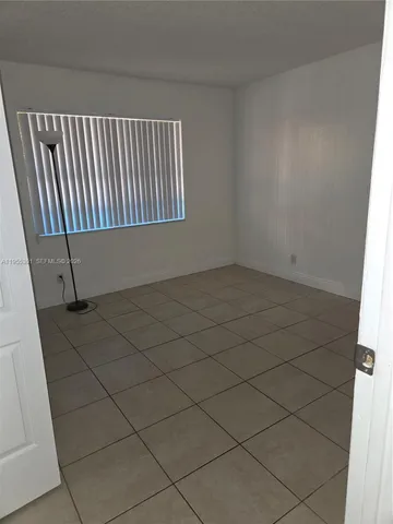 a bathroom with a toilet and shower