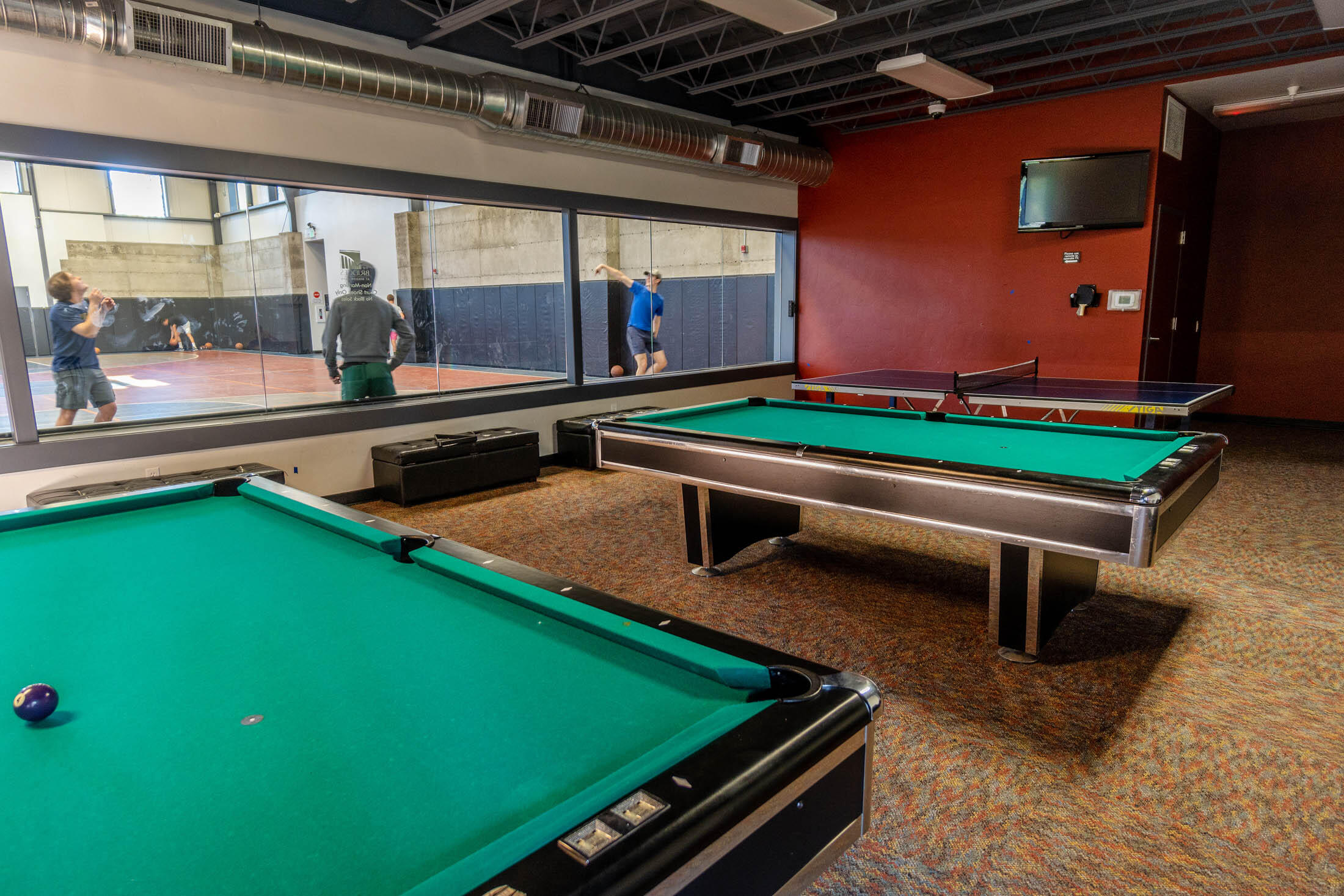 61129 Manhae Loop Bend, OR 97702 - Photo 33 of 44 Community photo, shared amenities. Gym with workout machines sports court and pool tables.
