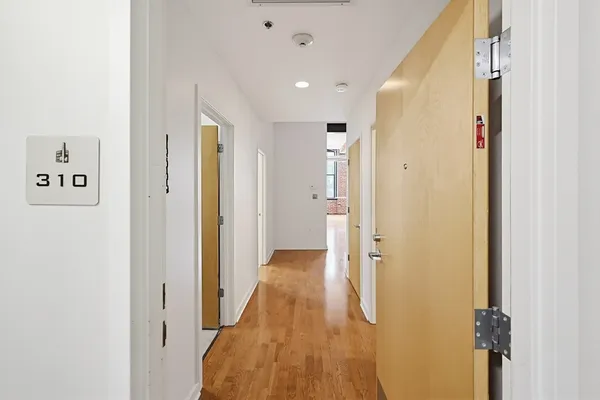 a kitchen with stainless steel appliances a refrigerator and a stove top oven