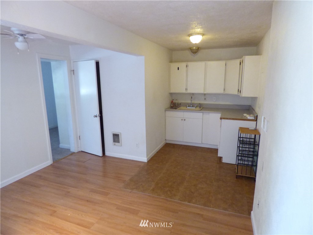 6524 Tyee Road Everett, WA 98203 - Photo 14 of 15 a view of a kitchen with a sink and a refrigerator