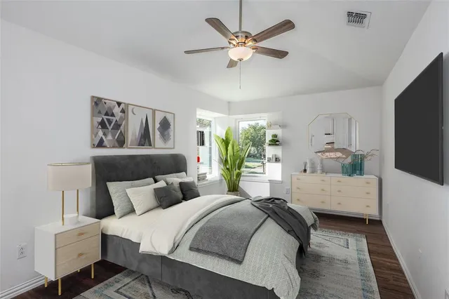 a bedroom with a bed and a couch