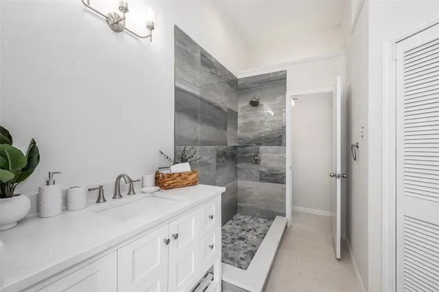 a bathroom with a sink and a shower