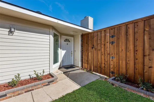 a view of a backyard with potted plants