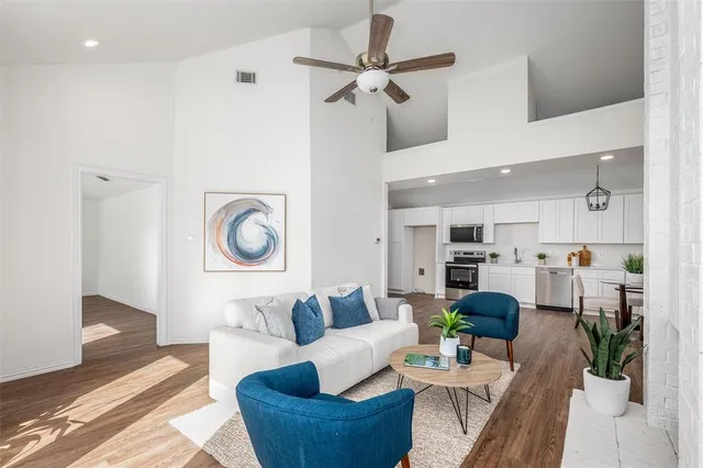 a living room with furniture and a clock