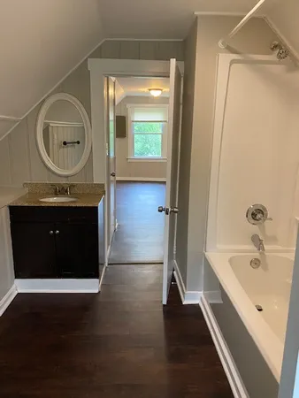 a en suite bathroom with a sink and a mirror