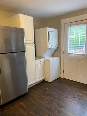 a white refrigerator freezer sitting in a kitchen