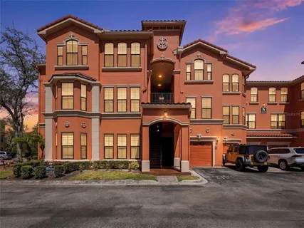 a front view of a residential apartment building with a yard