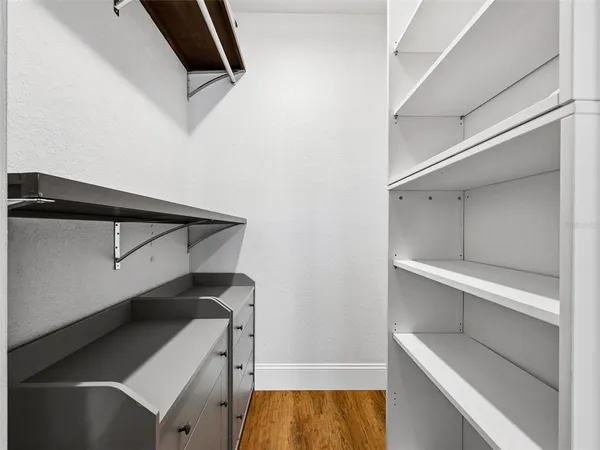 an aerial view of residential houses with outdoor space and lake view