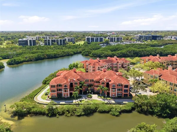 an aerial view of a house with a swimming pool yard and outdoor seating