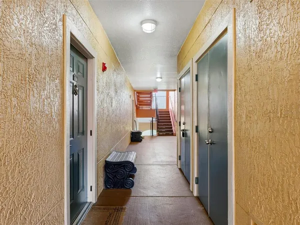 a view of swimming pool with outdoor seating and a garden
