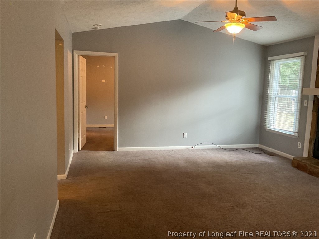 2279 Hackney Loop Fayetteville, NC 28304 - Photo 3 of 11 a view of an empty room with a window