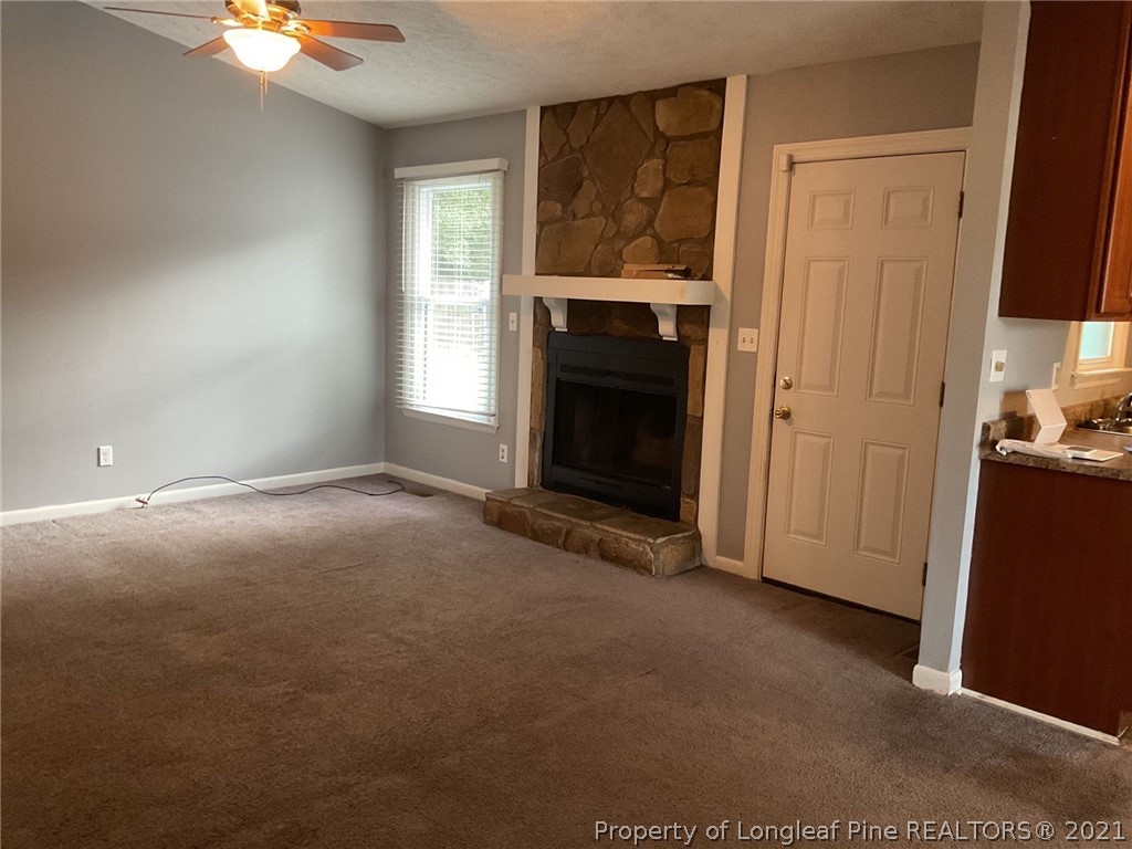 2279 Hackney Loop Fayetteville, NC 28304 - Photo 4 of 11 a view of empty room with window and fireplace