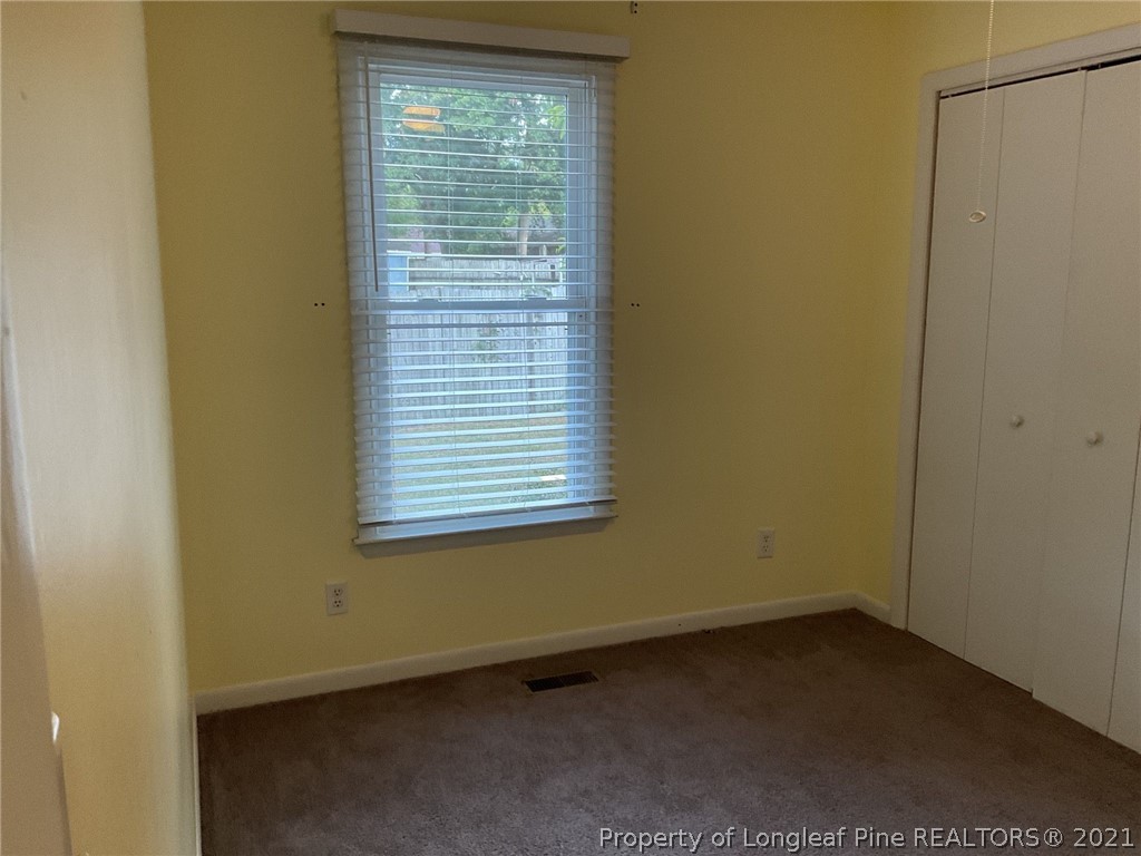 2279 Hackney Loop Fayetteville, NC 28304 - Photo 6 of 11 a view of an empty room with a window