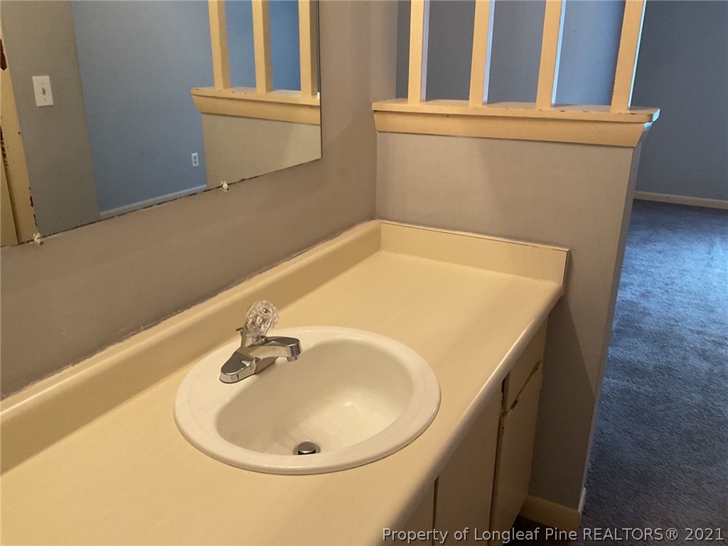 2279 Hackney Loop Fayetteville, NC 28304 - Photo 9 of 11 a bathroom with a sink
