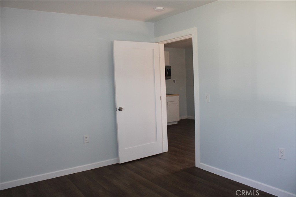 5776 Katherine Street Simi Valley, CA 93063 - Photo 8 of 15 a view of an empty room with wooden floor